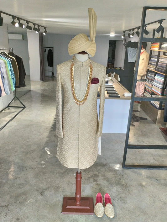 Shahjahan sand gold sherwani with resham self-embroidery from the Montazeri collection. Best sherwani for dulha and groom—crafted for elegance and grace.