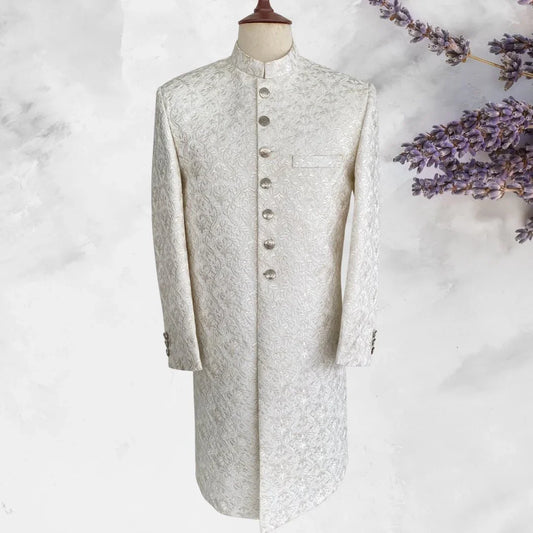 Off-white self-embroidered sherwani with gold buttons and matching kurta trousers. Groomswear edition. Best sherwani for dulha and groom—classic and elegant.
