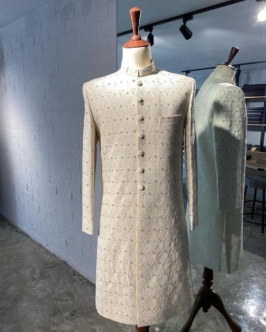 Off-white Karandi sherwani with resham and dabka hand embroidery. A timeless look for dulhas. Best sherwani for groom, designed for elegance and tradition.