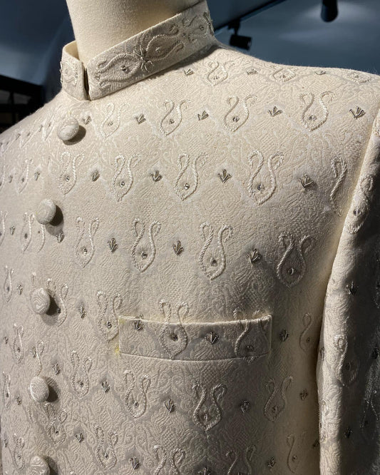 Off-white Karandi sherwani with resham and dabka hand embroidery. A timeless look for dulhas. Best sherwani for groom, designed for elegance and tradition.