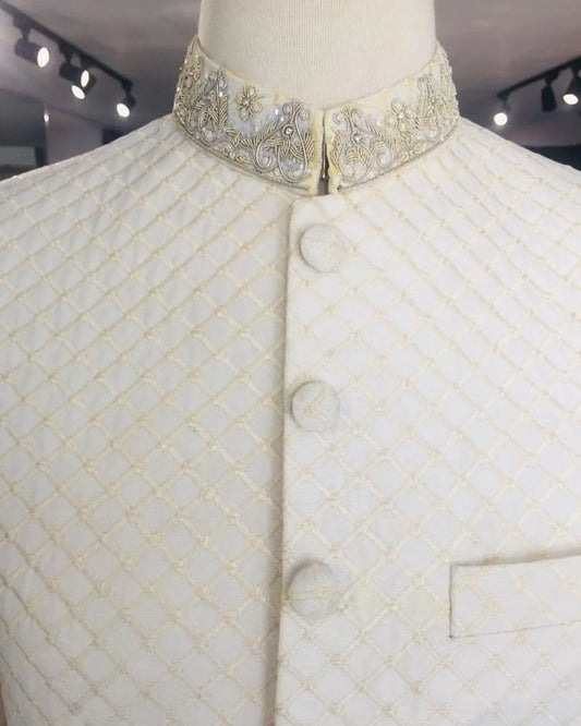 Self-embroidered sherwani with detailed dabka handwork on collar and sleeves. A perfect pick for dulha. Best sherwani for groom from our wedding collection.