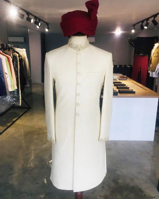 Self-embroidered sherwani with detailed dabka handwork on collar and sleeves. A perfect pick for dulha. Best sherwani for groom from our wedding collection.