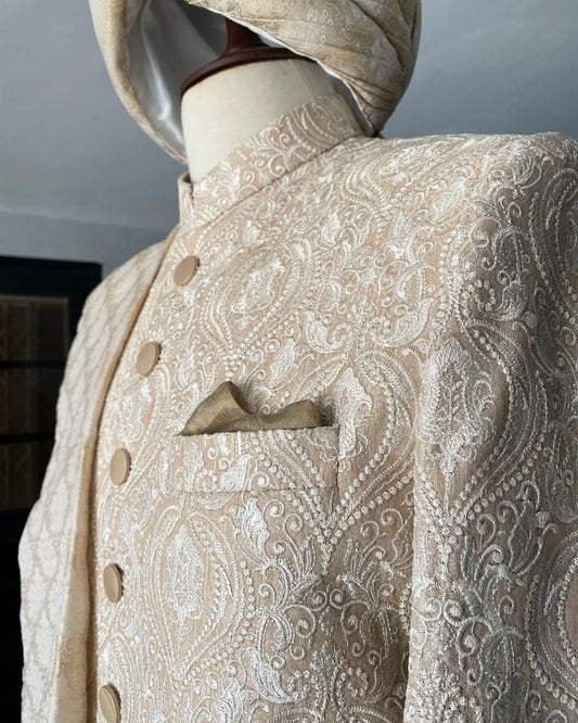 Crystal pink sherwani with beige thread work & matte gold buttons, paired with dull gold Jamawar turban. Best sherwani for dulha & groom—fresh and elegant look.