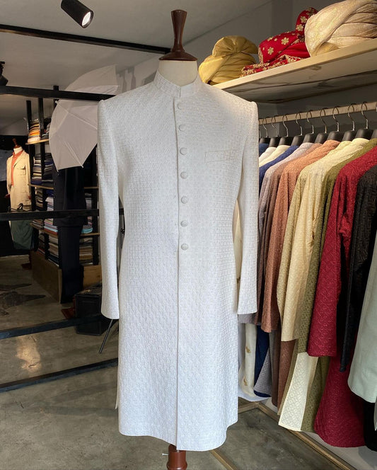 Pearl white self-embroidered sherwani with resham & gold sequins. Includes inner kurta trousers. Best sherwani for groom & dulha—elegant and timeless choice.