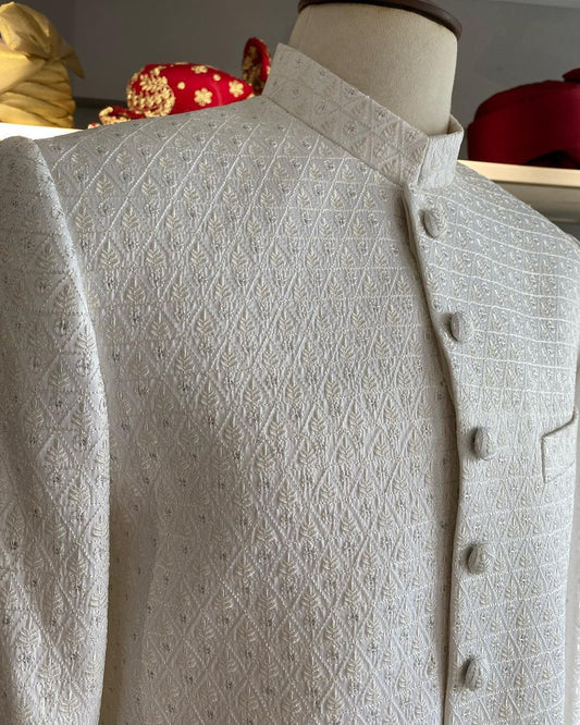 Pearl white self-embroidered sherwani with resham & gold sequins. Includes inner kurta trousers. Best sherwani for groom & dulha—elegant and timeless choice.