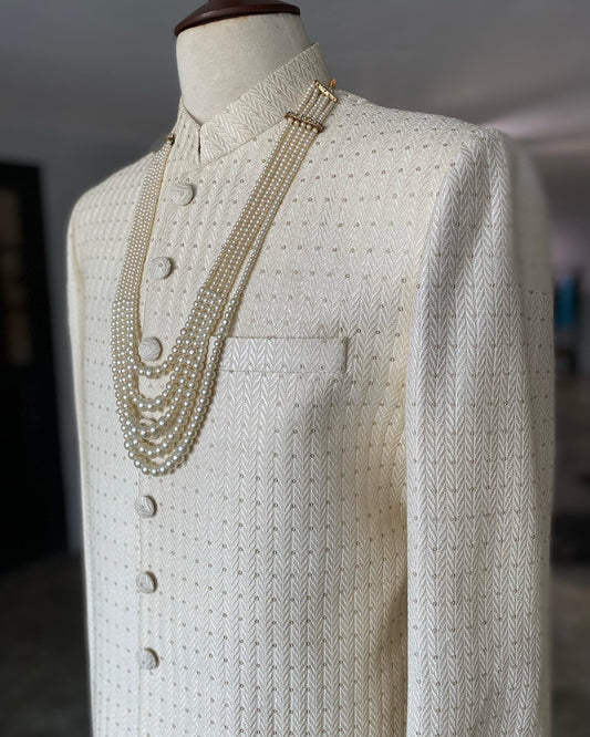 Pearl white self-embroidered sherwani with resham & gold sequins. Includes inner kurta trousers. Best sherwani for groom & dulha—elegant and timeless choice.