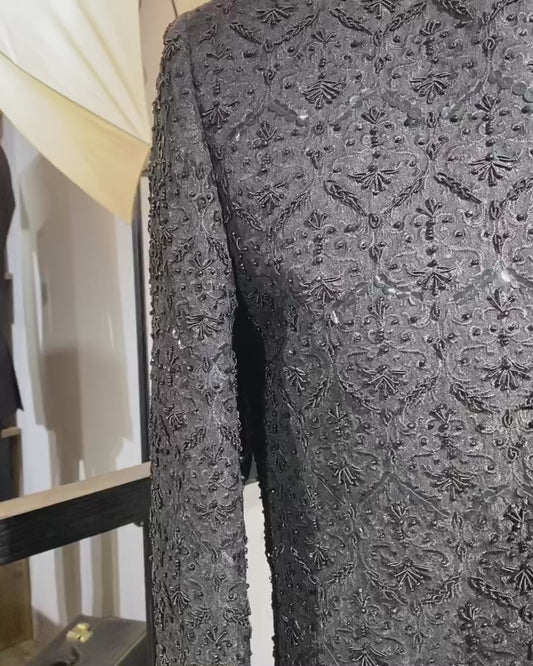 MAHARAJAH black raw silk sherwani with self embroidery and hand kora-dabka work. Best sherwani for groom & dulha—perfect for a bold, royal wedding look.