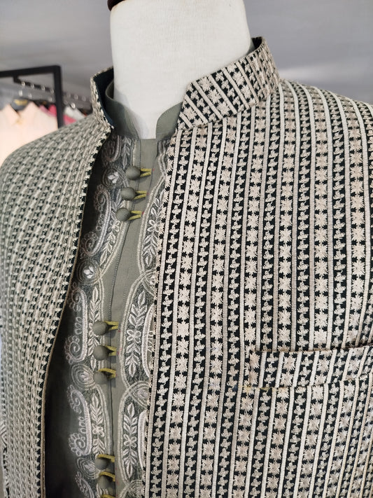 Bottle green front-open sherwani with gold handwork, paired with sage green embroidered kurta. Best sherwani for dulha and groom—perfect for any grand occasion.